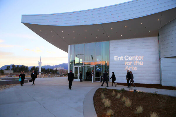people walking into the Ent Center at dusk