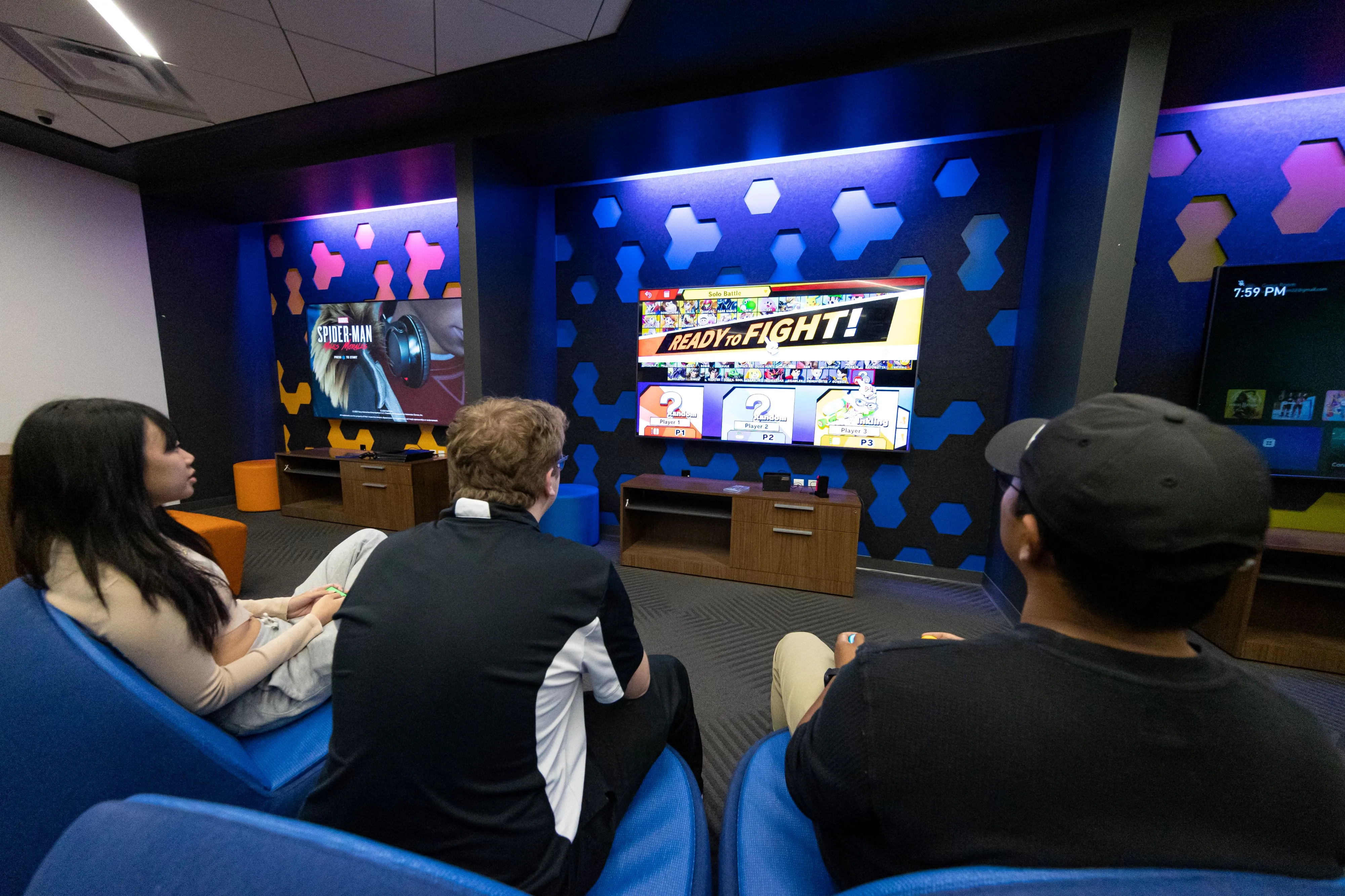 Students playing a game in the game room